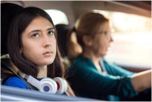teenage girl in the car with her mom
