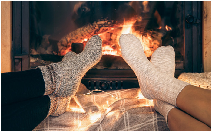 cozy socks by a fire